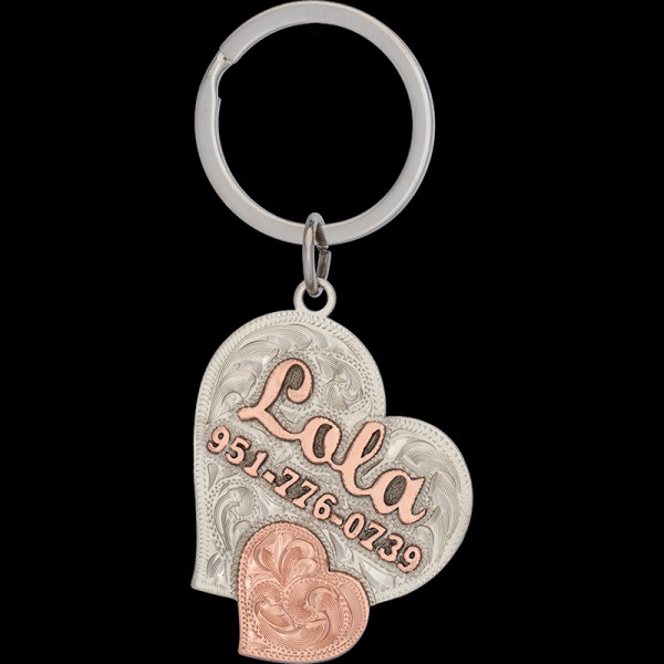 Buy our Lola Custom Dog Tag! Crafted from a German Silver base, adorned with copper letters and a heart motif. Keep your furry friend stylishly identified. Order now!